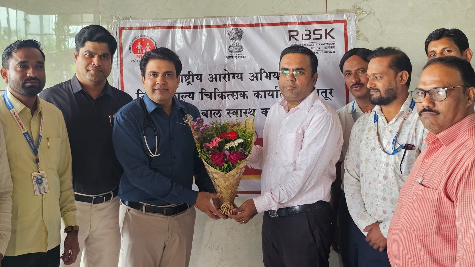 Dr. Pankaj Sugaonkar with families at an outreach camp